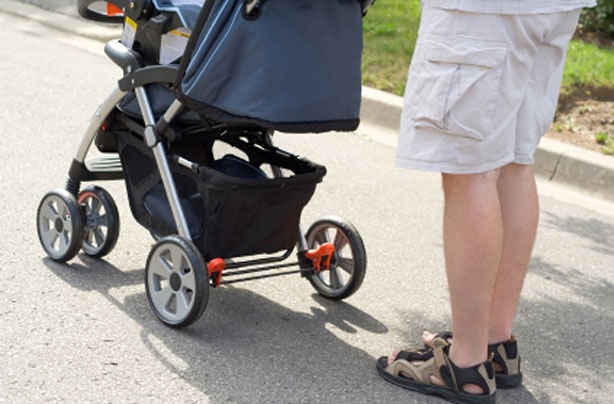 Dad and new baby in a pram Dad and new baby in a pram