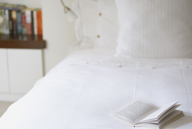 open book on bed open book on bed