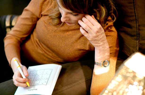 Woman doing Sudoku Woman doing Sudoku