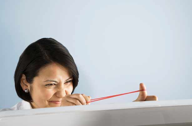 Woman flicking rubber band Woman flicking rubber band