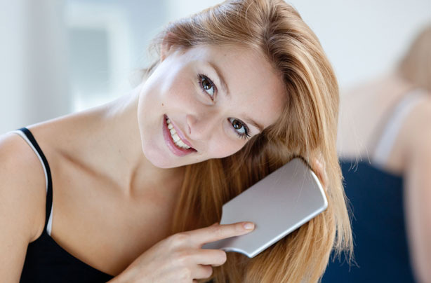 woman-brushing-hair-photo