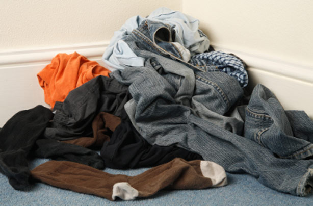 A man's dirty clothes on the floor A man's dirty clothes on the floor