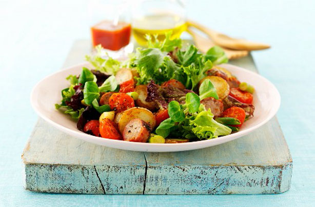 Sausage, roast new potato and tomato salad
