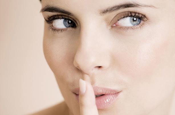 Woman with finger to lips Woman with finger to lips