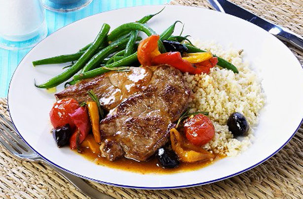 Pork steaks with peppers and olives