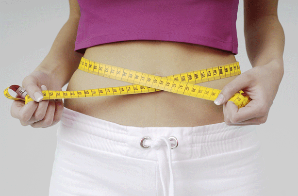 woman measuring waist photo