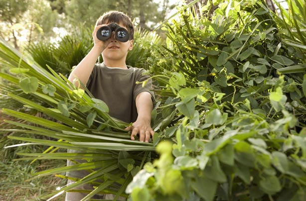 Boy looking through binoculars Boy looking through binoculars