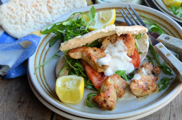 Cajun chicken kebabs with wraps, dip and salad