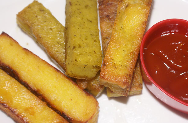 Cheese and basil pesto polenta chips