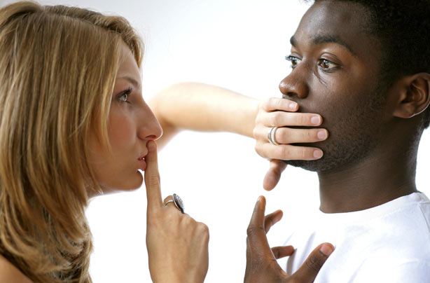 Couple whispering secret