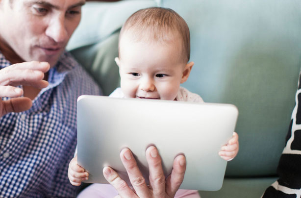 Baby playing with tablet