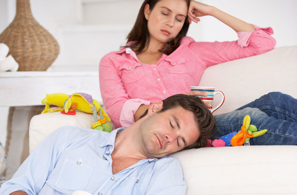 Parents sleeping surrounded by toys Parents sleeping surrounded by toys