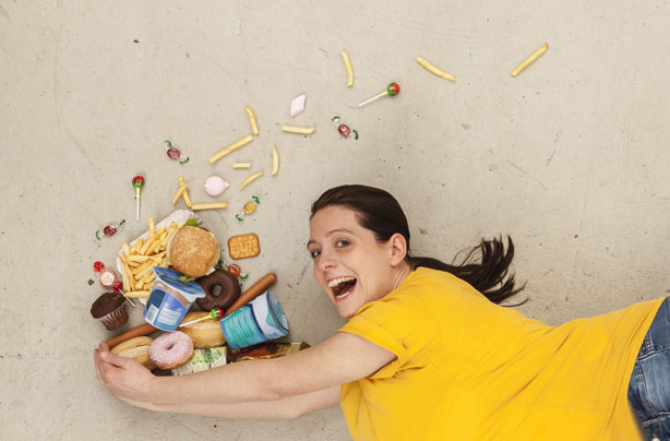 Woman juggling food Woman juggling food