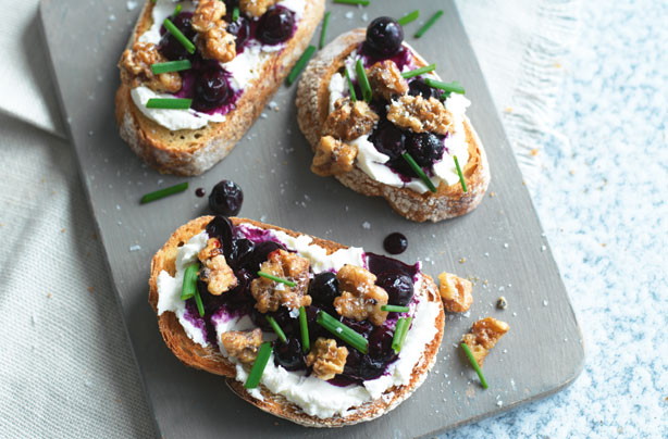 Goat's curd on rye with blueberries and spiced walnuts