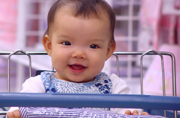 Baby in a shopping trolley