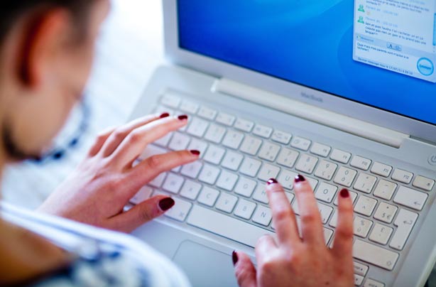 Teenage girl using laptop