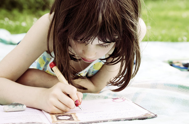 Little girl writing a letter Little girl writing a letter