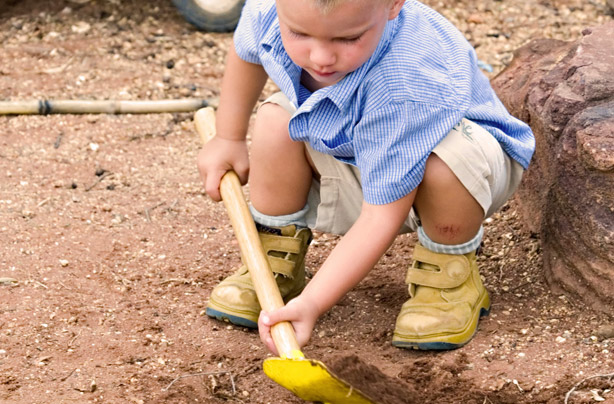 Little boy playing in mud Little boy playing in mud