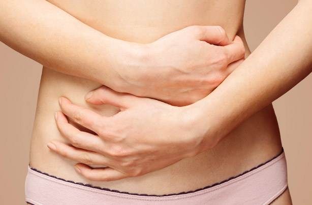 Woman holding tummy