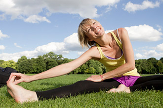 A woman stretching in the park