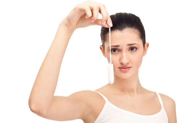 Woman holding tampon