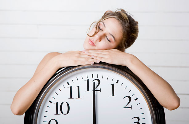 Woman asleep on a clock