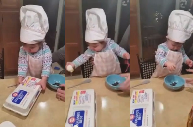Toddler cracking an egg