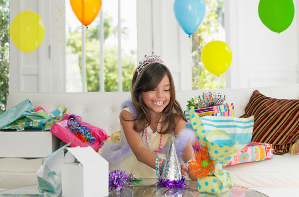 Child opening birthday presents