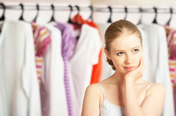Woman in front of clothes, wardrobe, dressing Woman in front of clothes, wardrobe, dressing