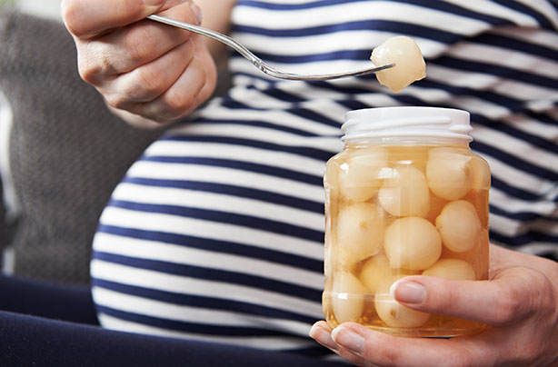Pregnancy cravings, pregnant woman, pickled onions