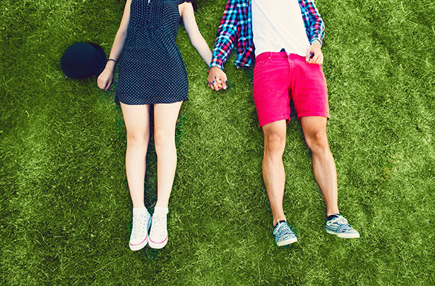 Couple lying on grass, outdoors, relationship, cheating, boyfriend, girlfriend
