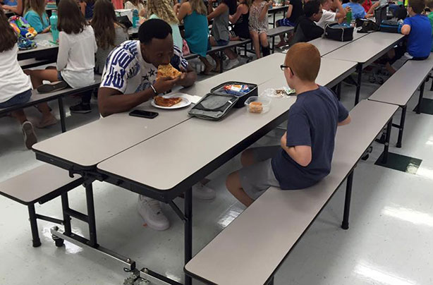 Leah Paske, footballer eats lunch with autistic son