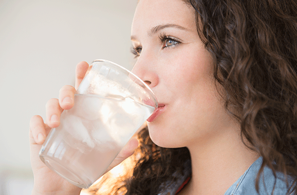 Woman drinking water, benefits of drinking water