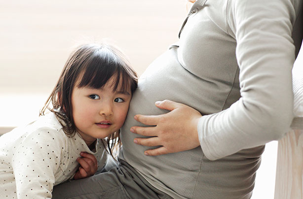 Siblings, pregnant woman with child, bump