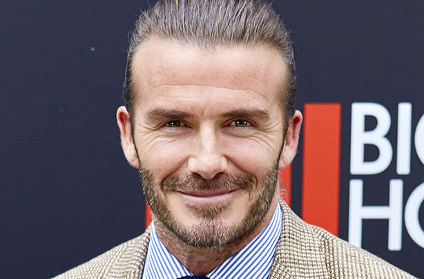 David Beckham defends kissing daughter Harper on the lips